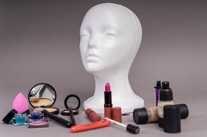 Professional cosmetology student using Shany foam mannequin head