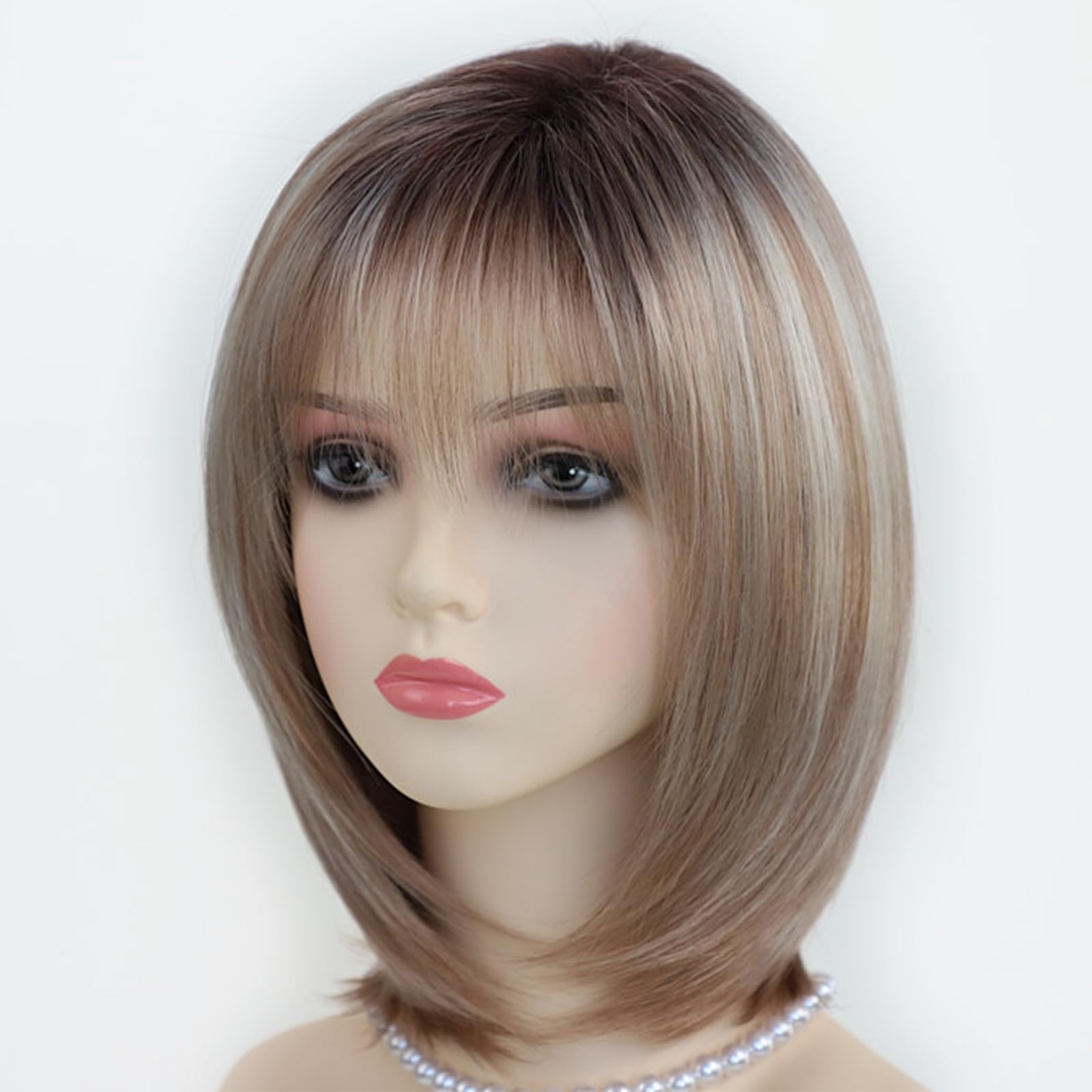 Side profile of short synthetic ombre blonde highlight hair wig with realistic dark roots.