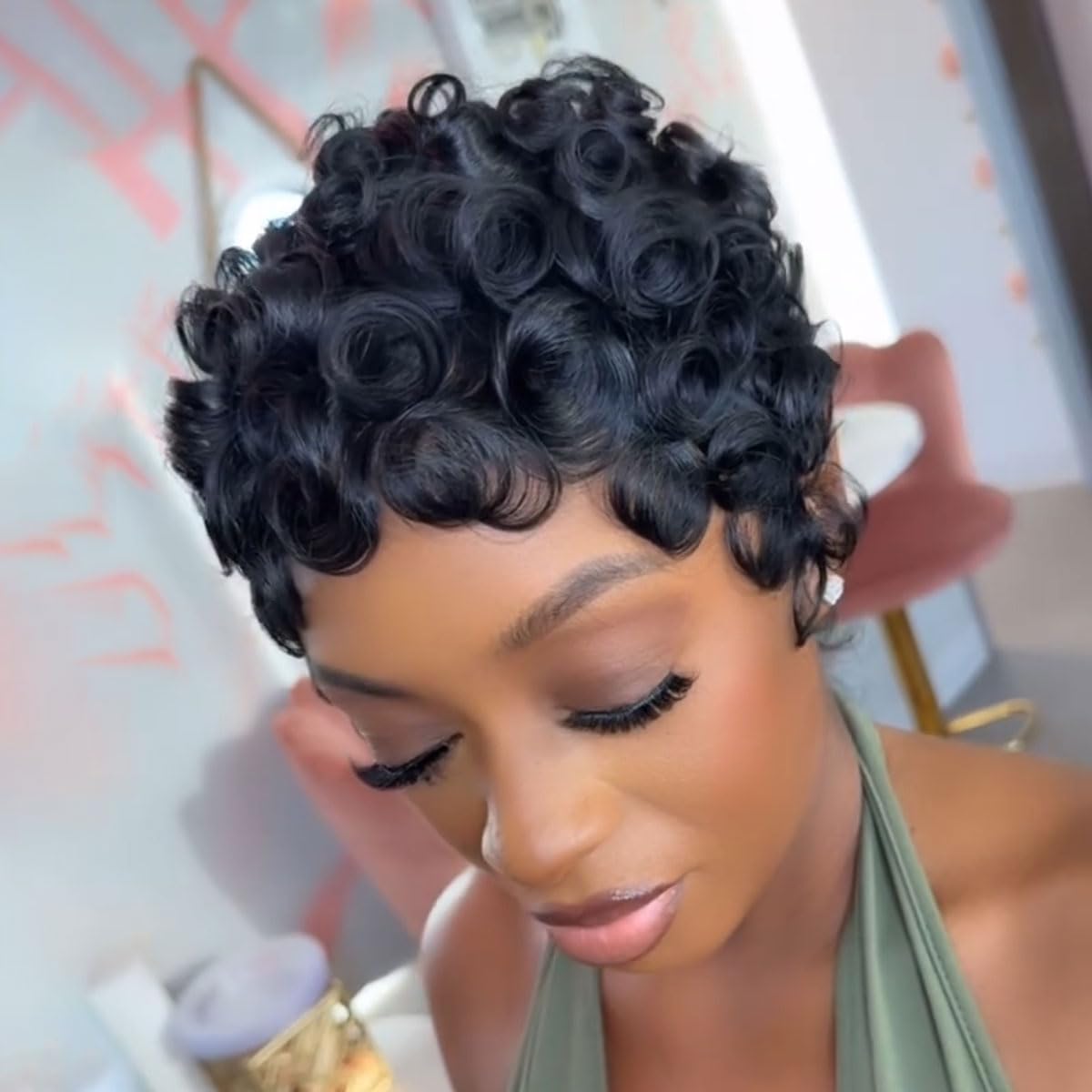 Close up details of the premium one hundred percent virgin human hair texture and defined wavy curl pattern.