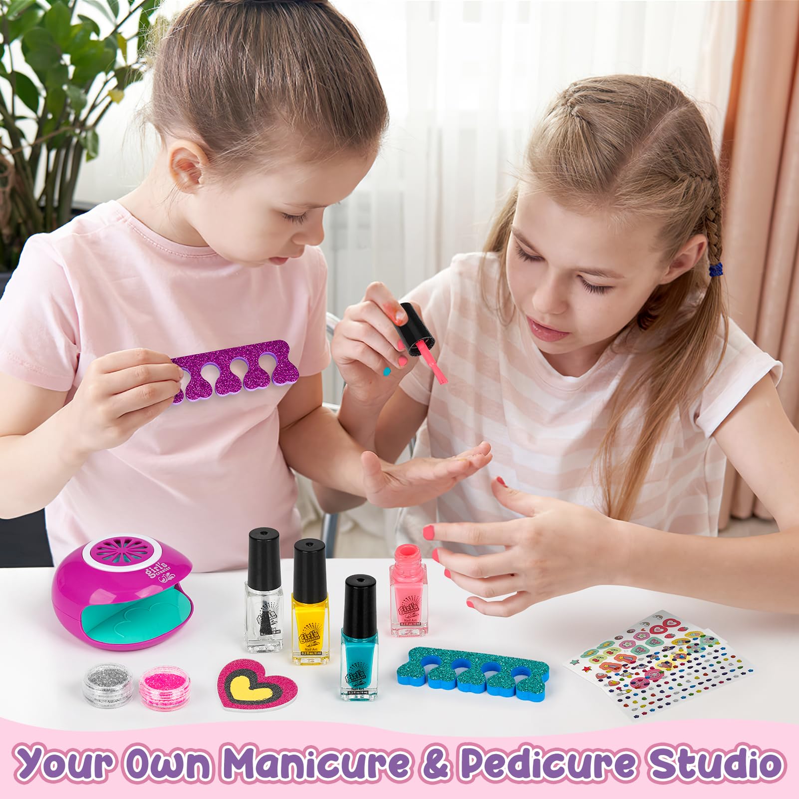 Child using the Dreamon nail dryer during an at-home spa session