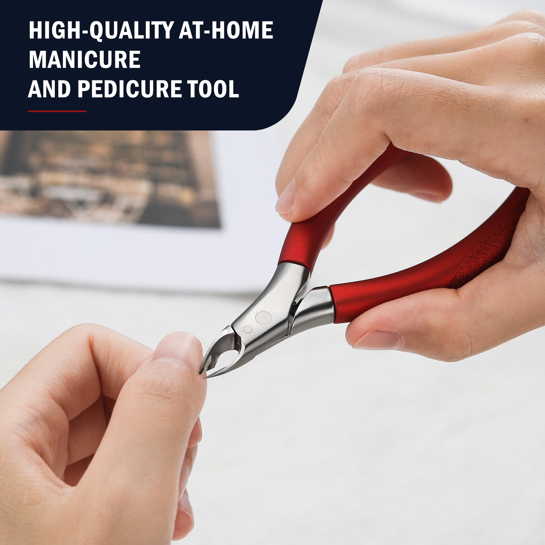 Compact red professional cuticle trimmer displayed next to a travel makeup kit.