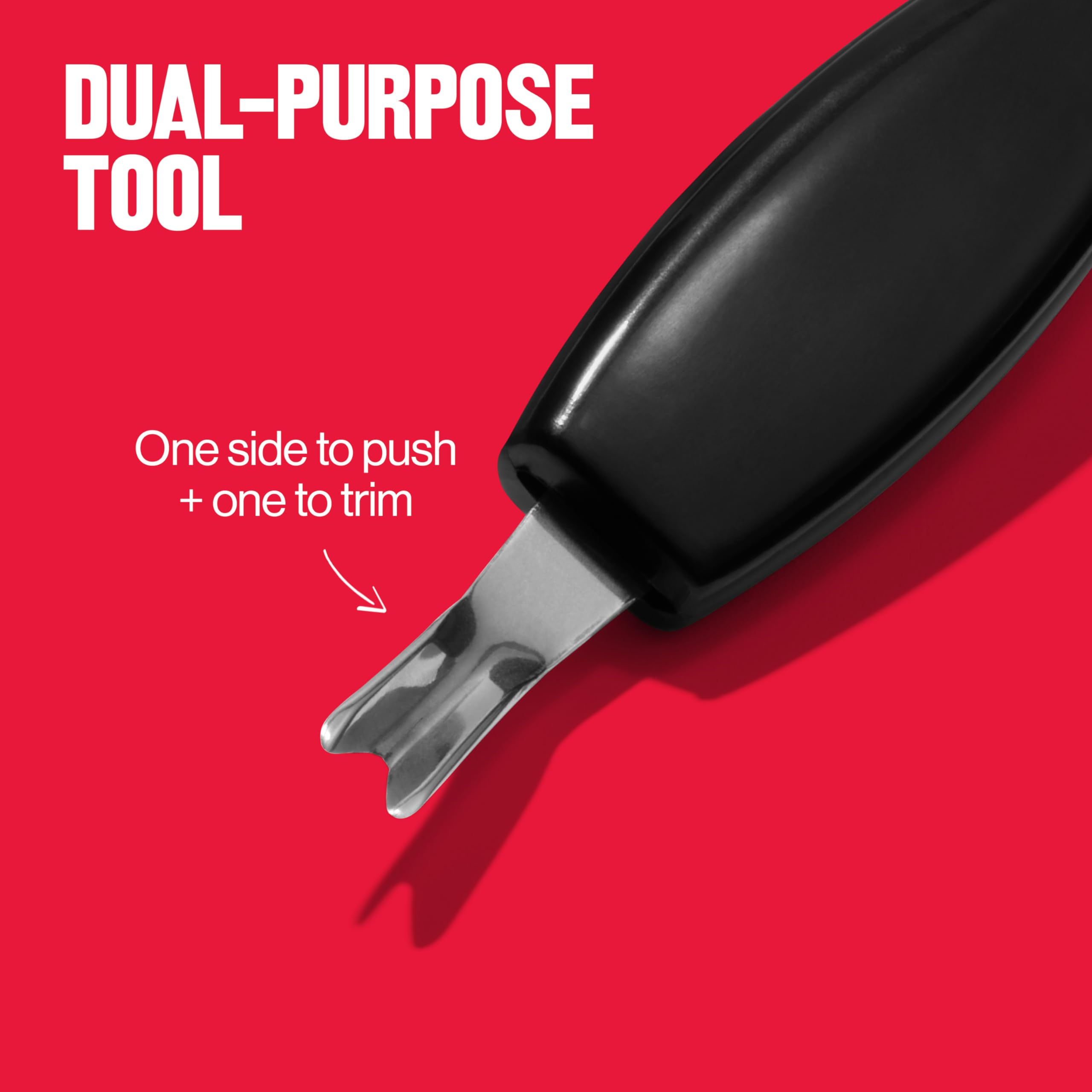 Hand holding Revlon stainless steel cuticle trimmer