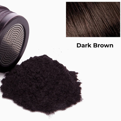 Close-up of plant-based hair fibers blending into dark brown hair to conceal the scalp