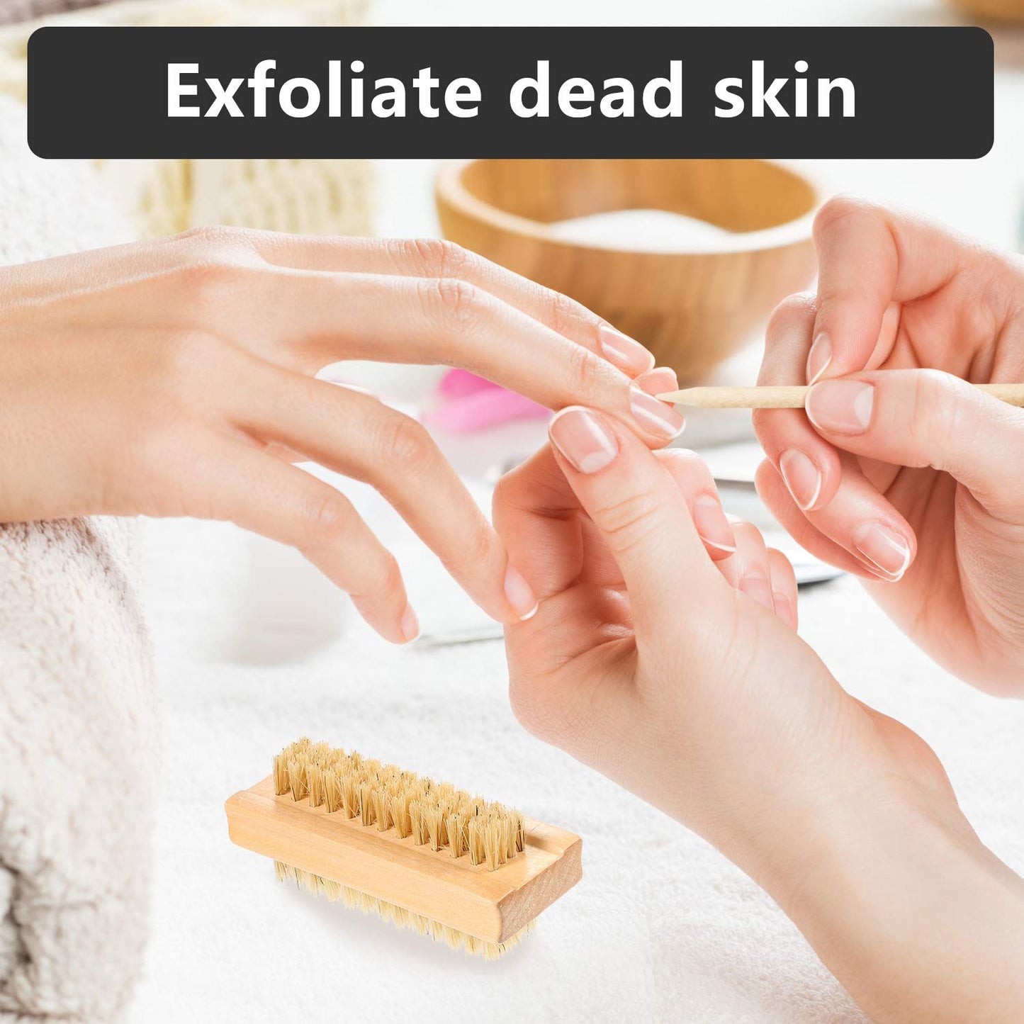 Hand holding orange wood stick for pushing back cuticles