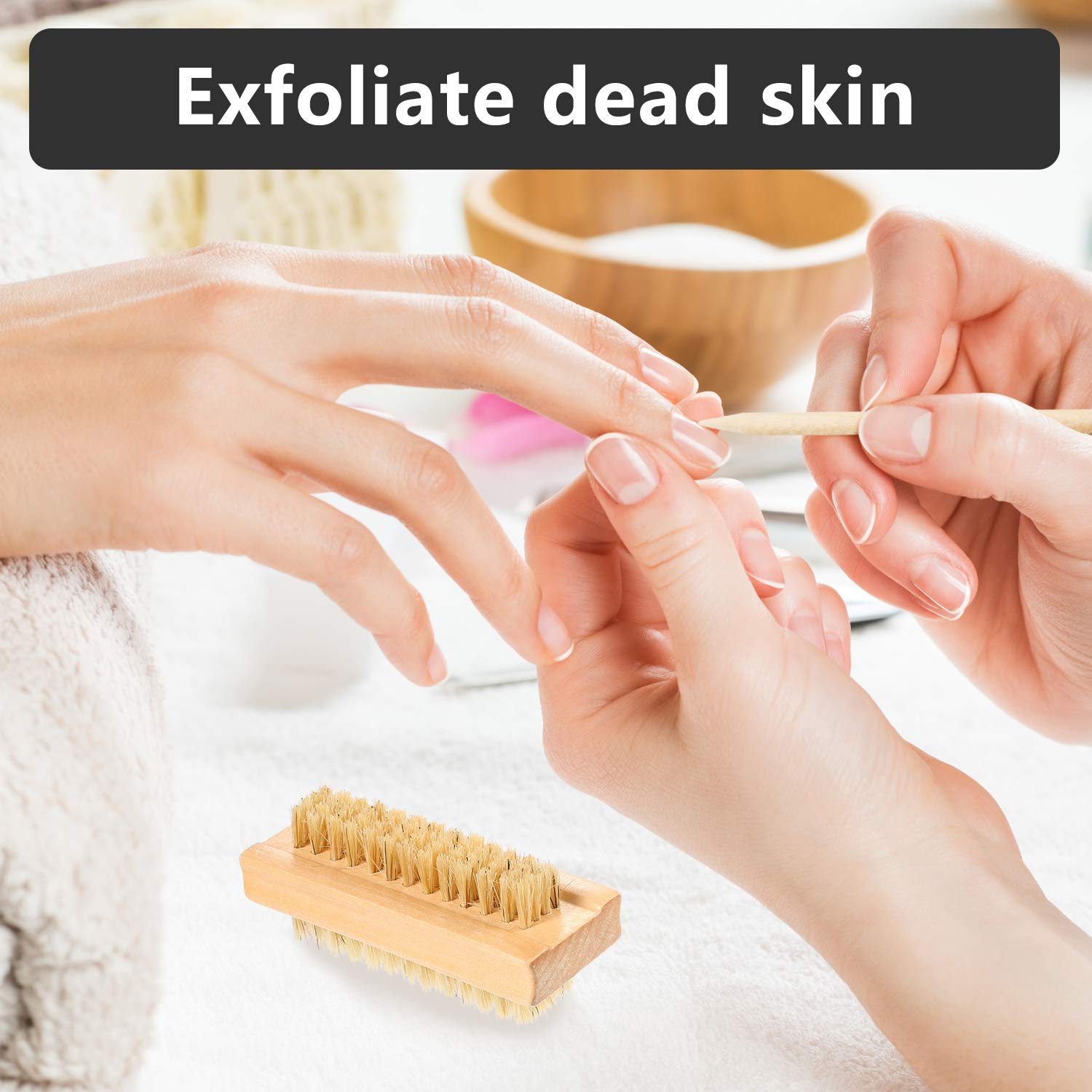 Hand holding orange wood stick for pushing back cuticles