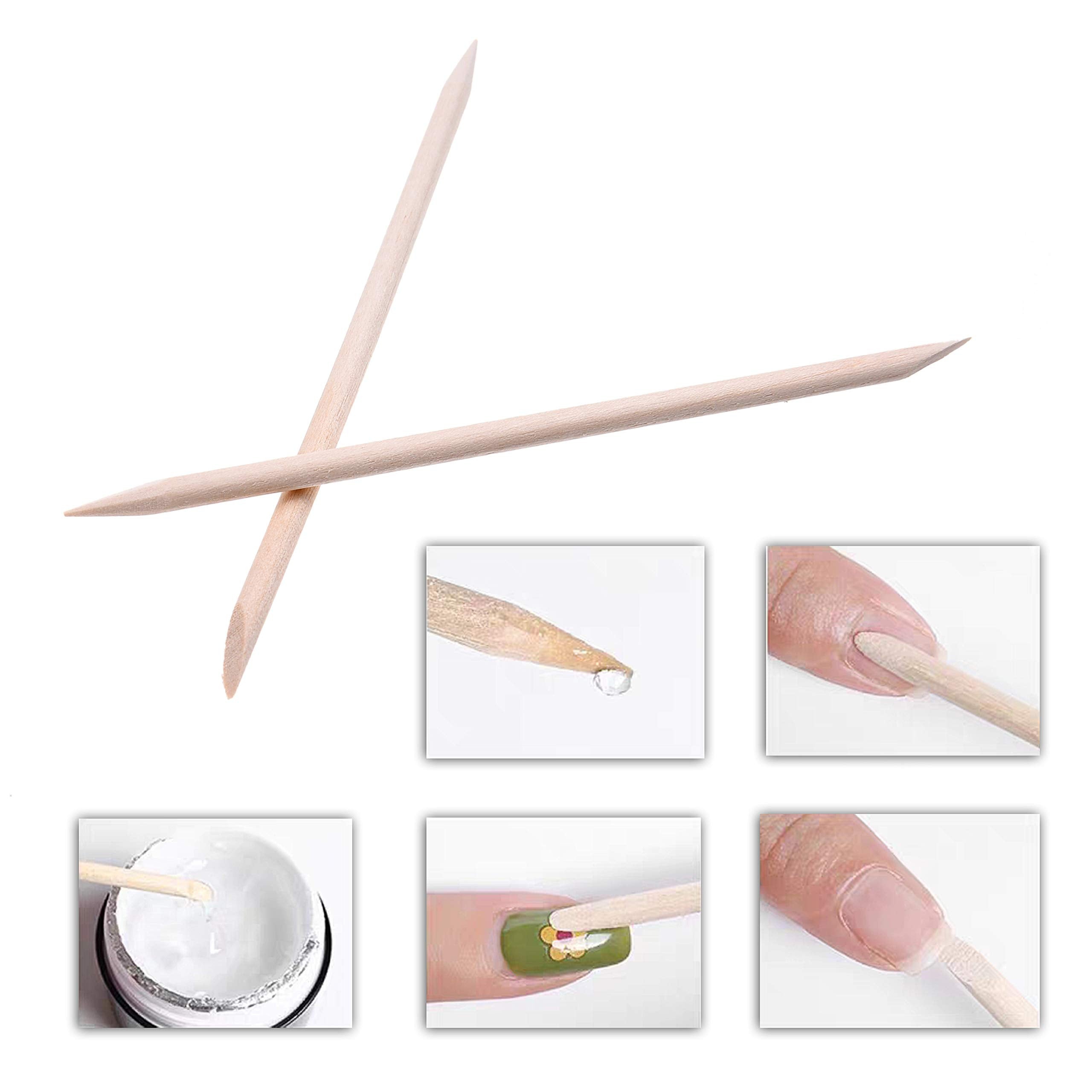 Close up of double sided orange wood cuticle pusher tips