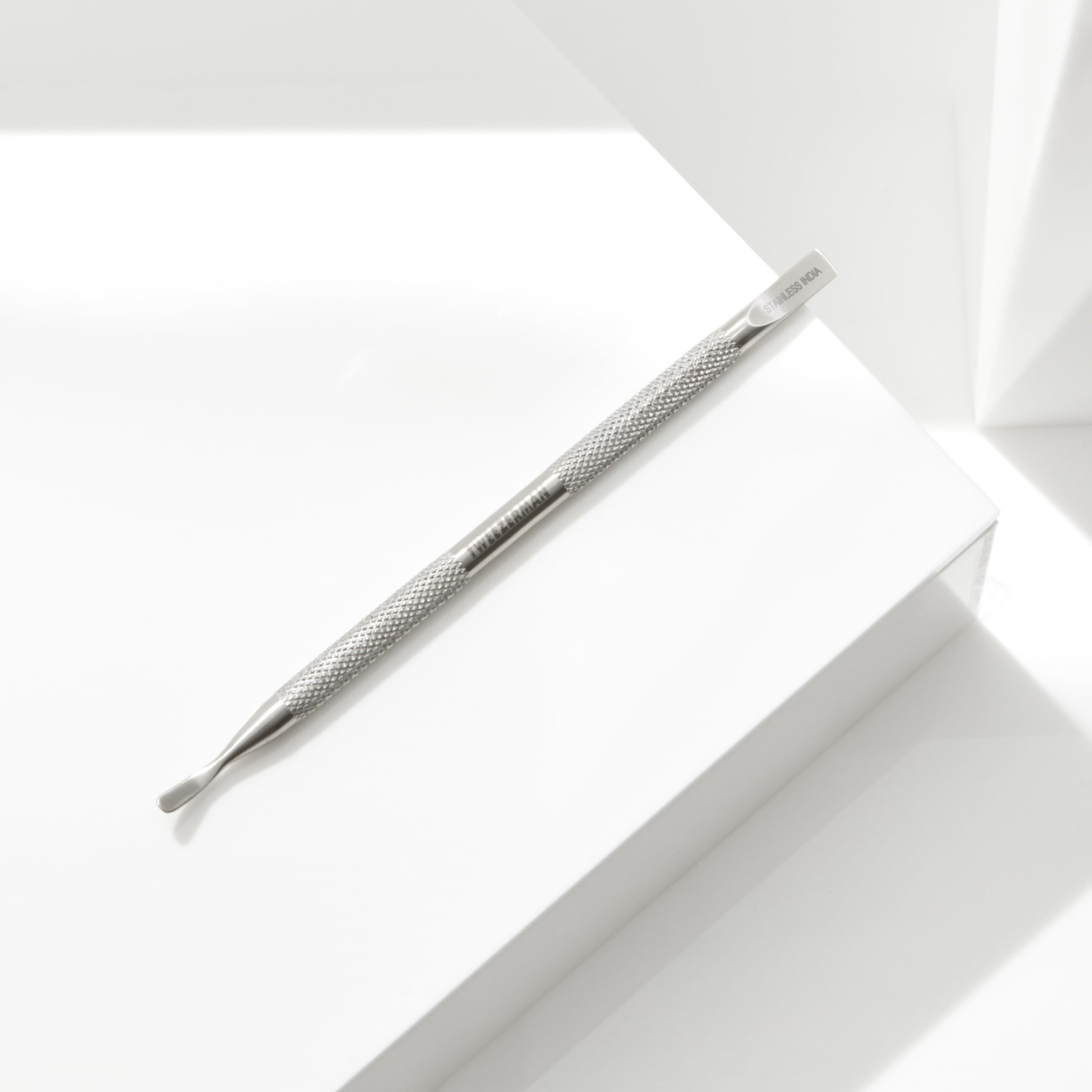 Ergonomic textured handle of Tweezerman manicure tool
