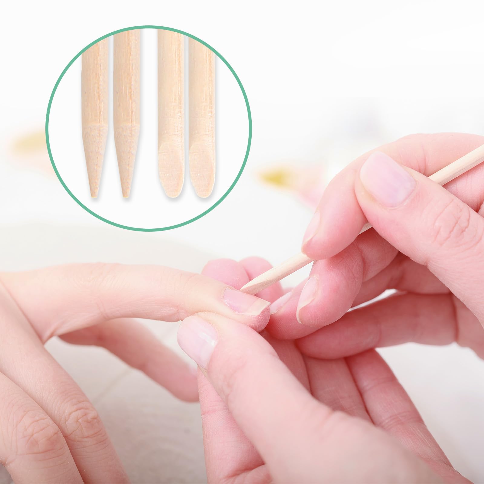 Person using wooden stick for manicure cuticle care