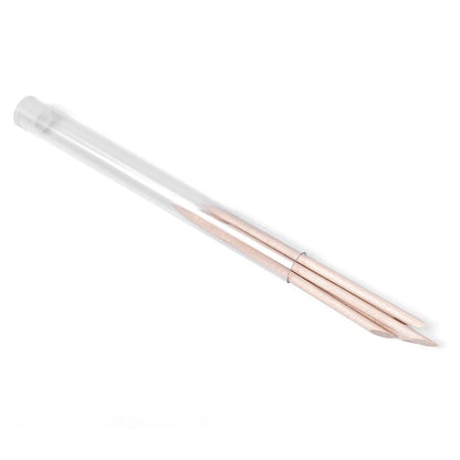 Close up of double-sided orange wood stick tips