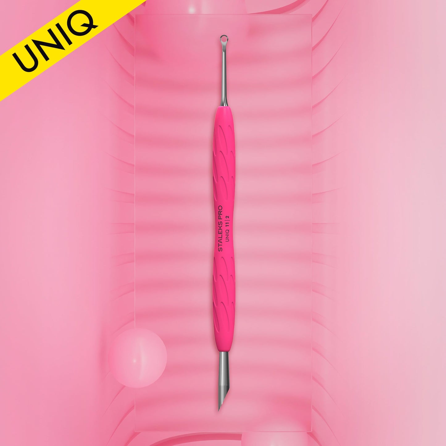 Ergonomic pink silicone handle of Staleks Pro nail tool