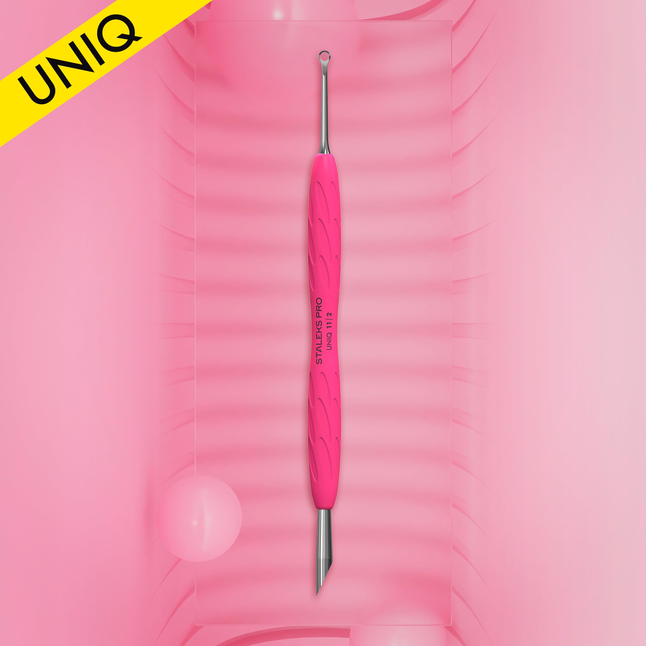 Ergonomic pink silicone handle of Staleks Pro nail tool