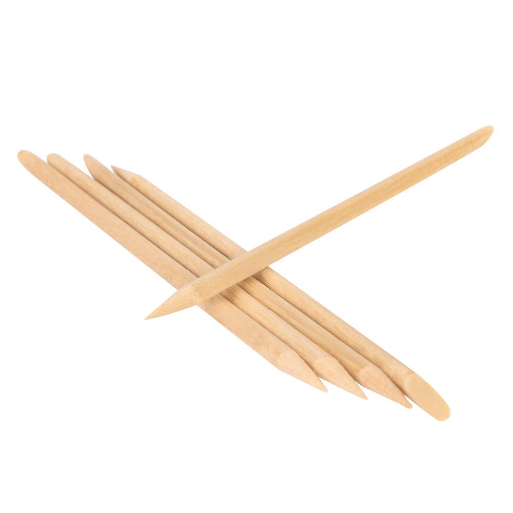 Close up of double ended wooden cuticle pusher tip