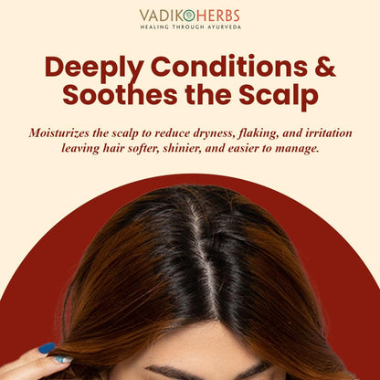 Texture shot of the clear Vadik Herbs Brahmi Hair Oil with natural Rosemary Oil for hair nourishment.