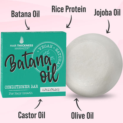 Applying Batana oil conditioner bar to wet hair