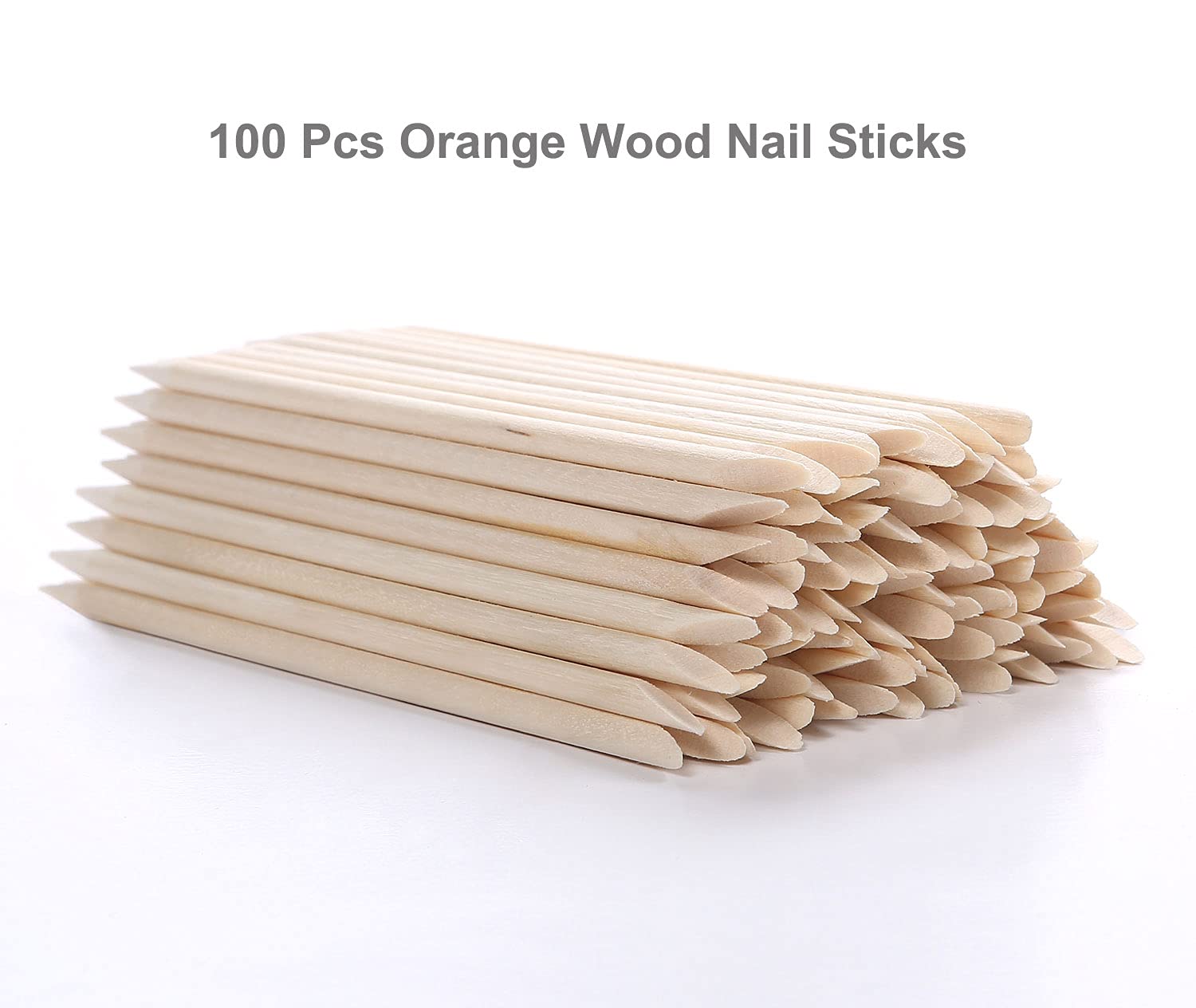 Close up of double ended orange wood nail stick tip