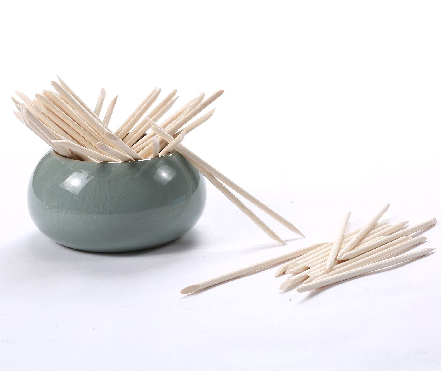 Pointed tip of orange wood stick for nail art precision