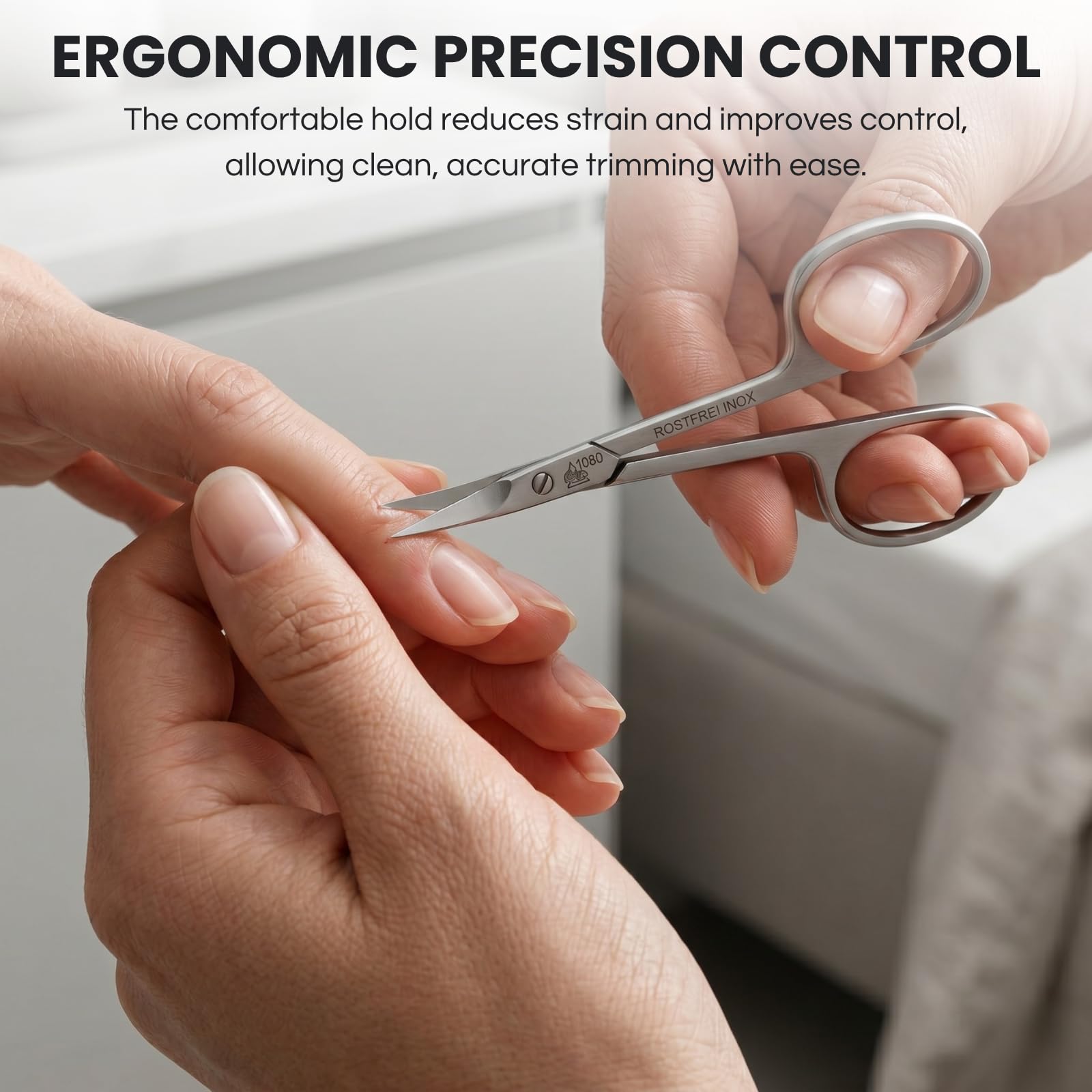 Close up view of the extra pointed tower point tip on Erbe professional manicure scissors