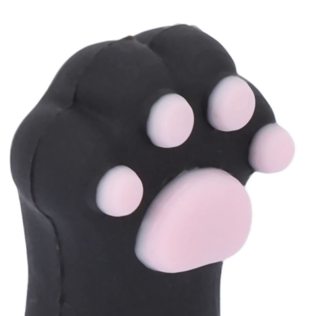 A complete set of five cat paw shaped nail scissor protectors next to a vanity pouch