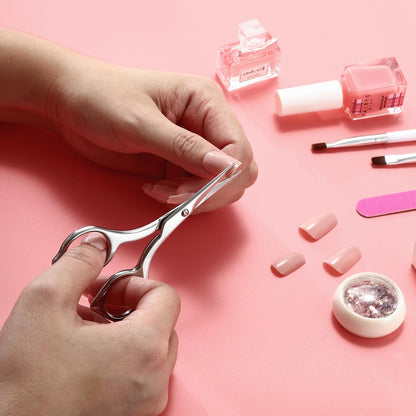 LIVINGO pedicure scissors being held to demonstrate the secure fatigue free handling design.