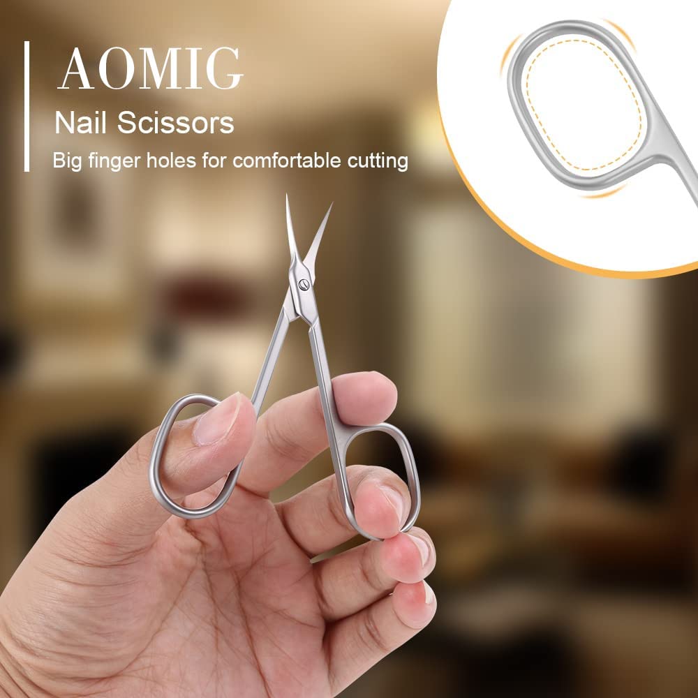 AOMIG stainless steel manicure scissors being used to trim dry cuticles safely