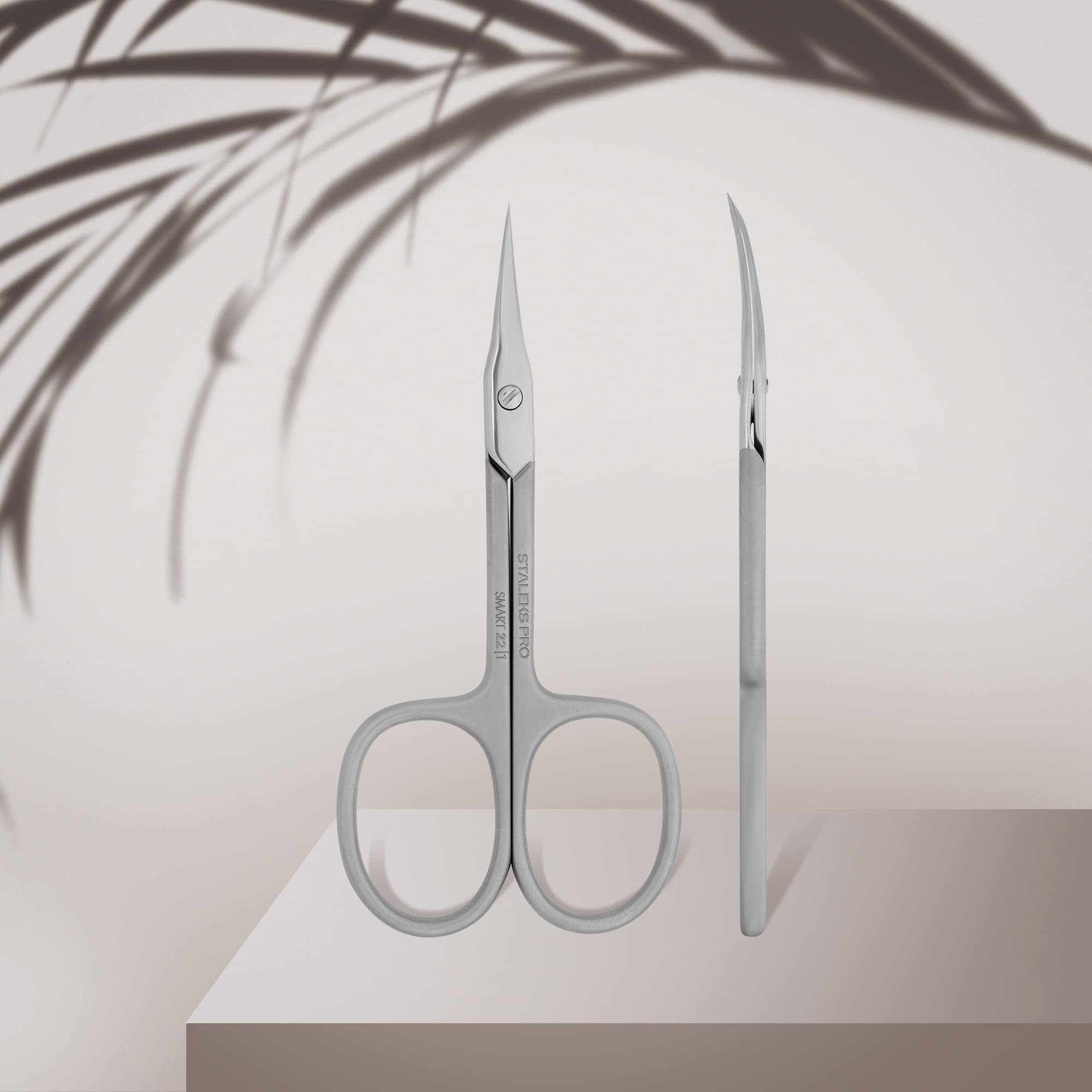 Close up view of the slim curved blades on the Staleks Smart 22 professional cuticle scissors