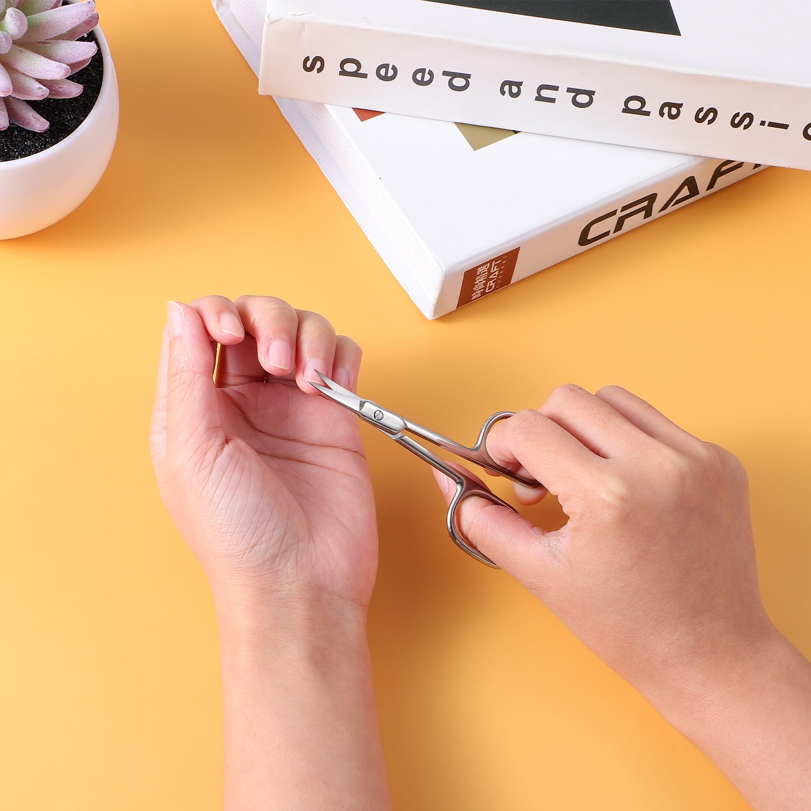 Multi purpose beauty scissors being used for precise eyebrow shaping and facial hair trimming applications.