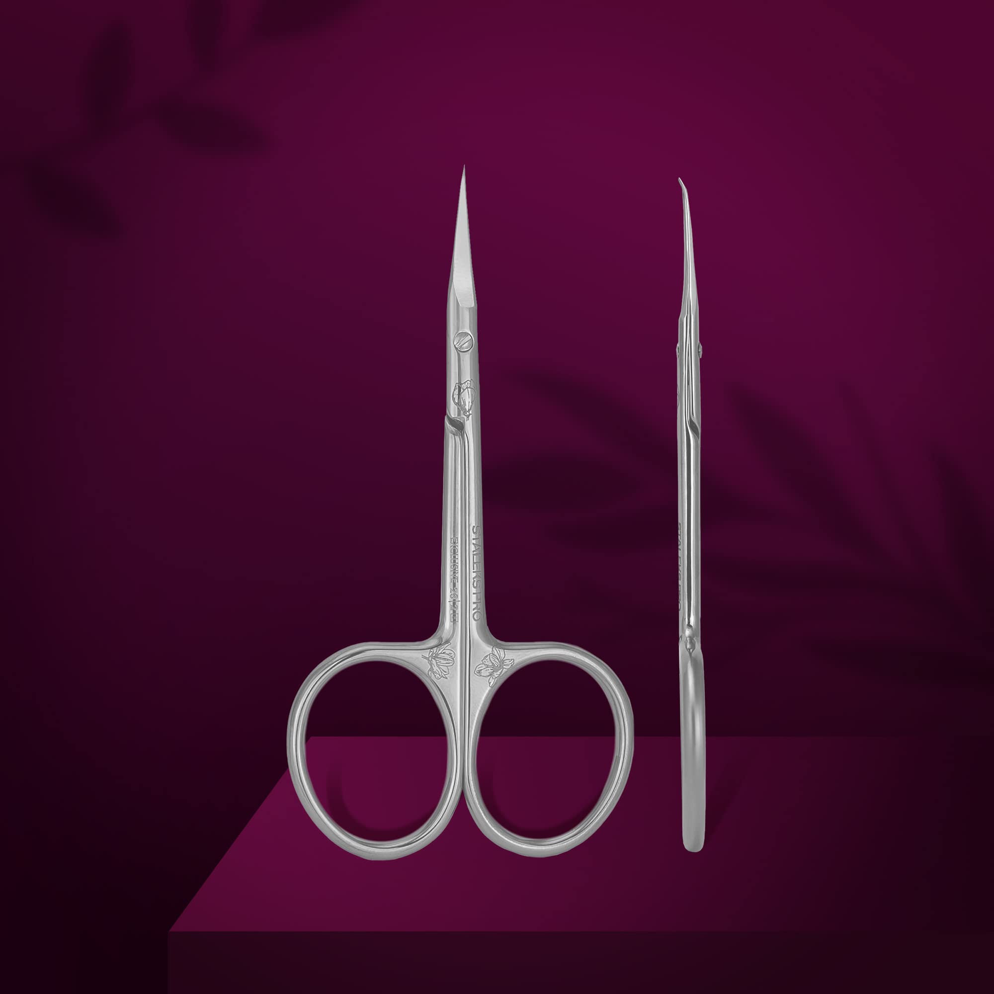 Side profile of the professional Staleks Pro cuticle trimming tool highlighting the narrow curved blades and microscope-sharpened edge.