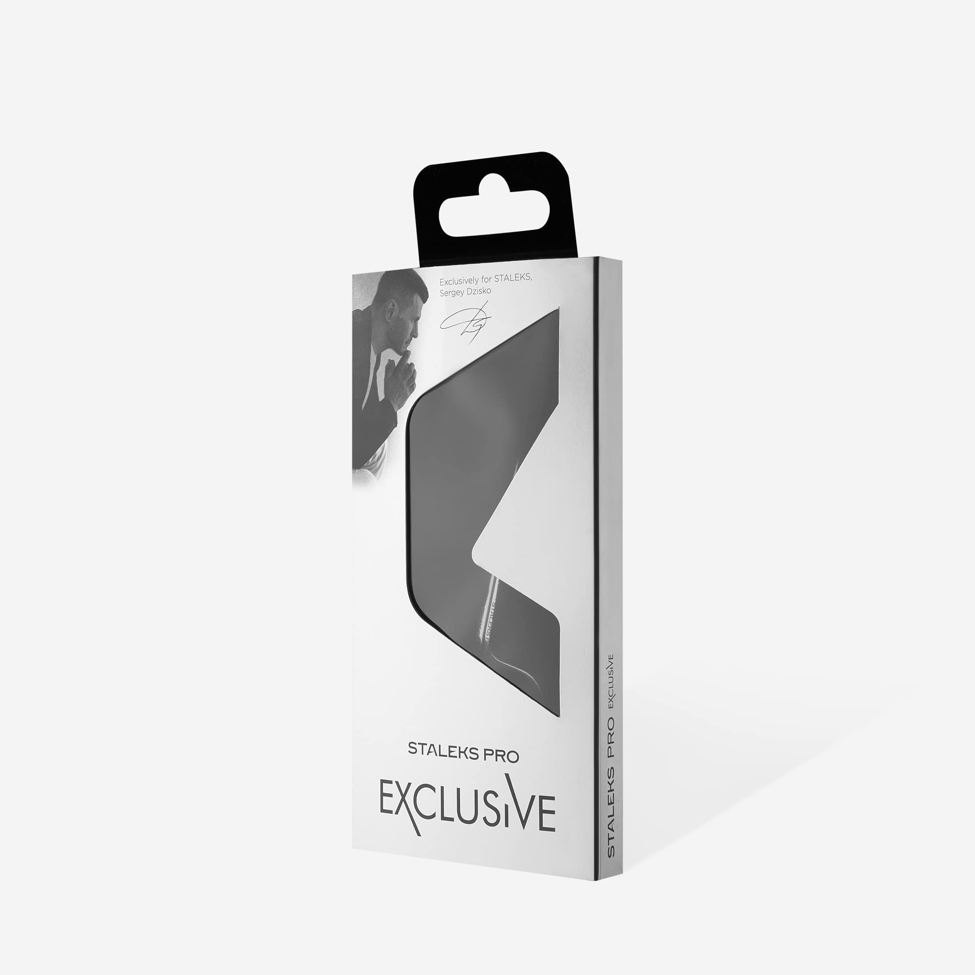 Staleks Pro Exclusive 23 Type 2 manicure scissors resting on a clean surface demonstrating the compact design for smaller hands.