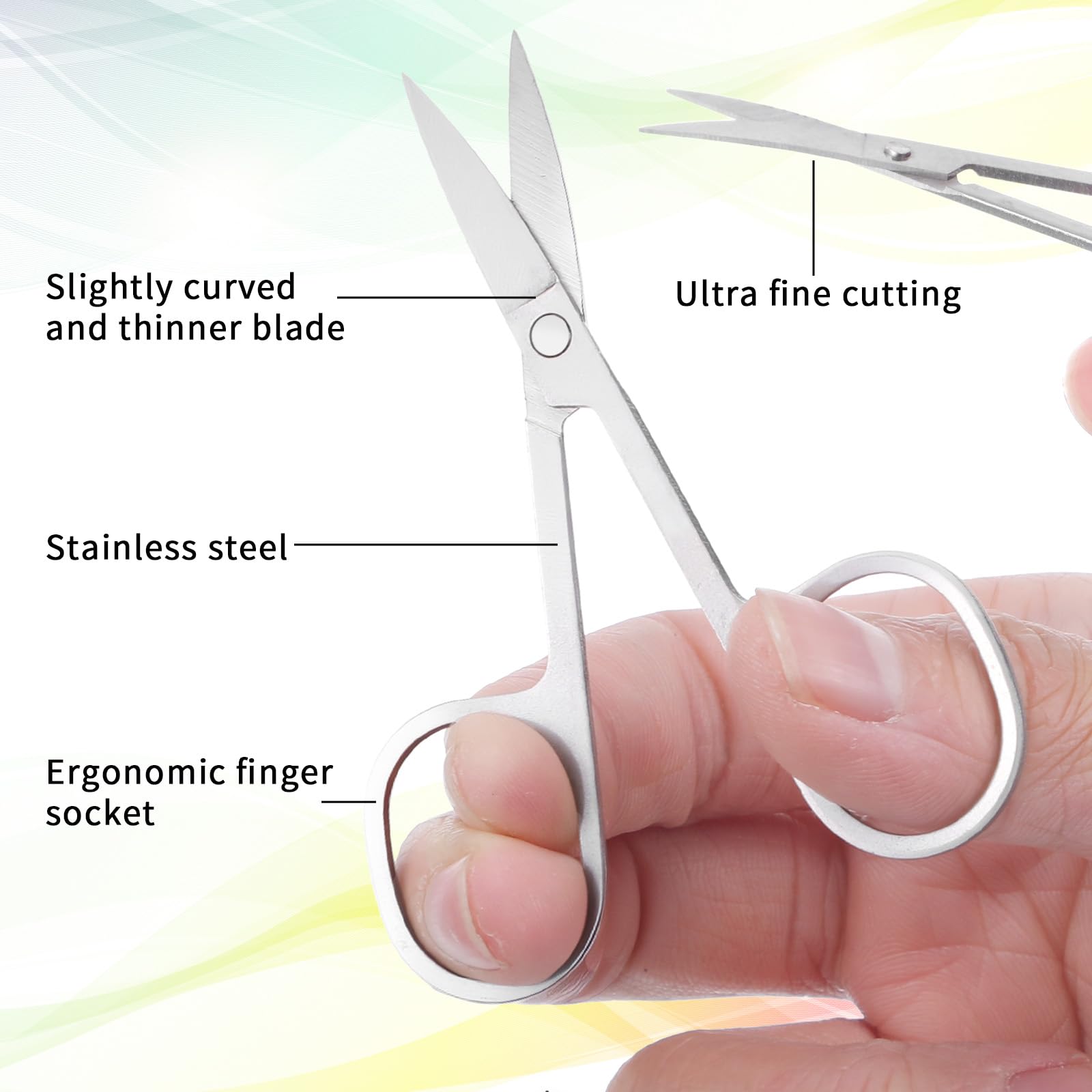 Portable eyebrow and eyelash scissors showing the sharp curved blade detail.