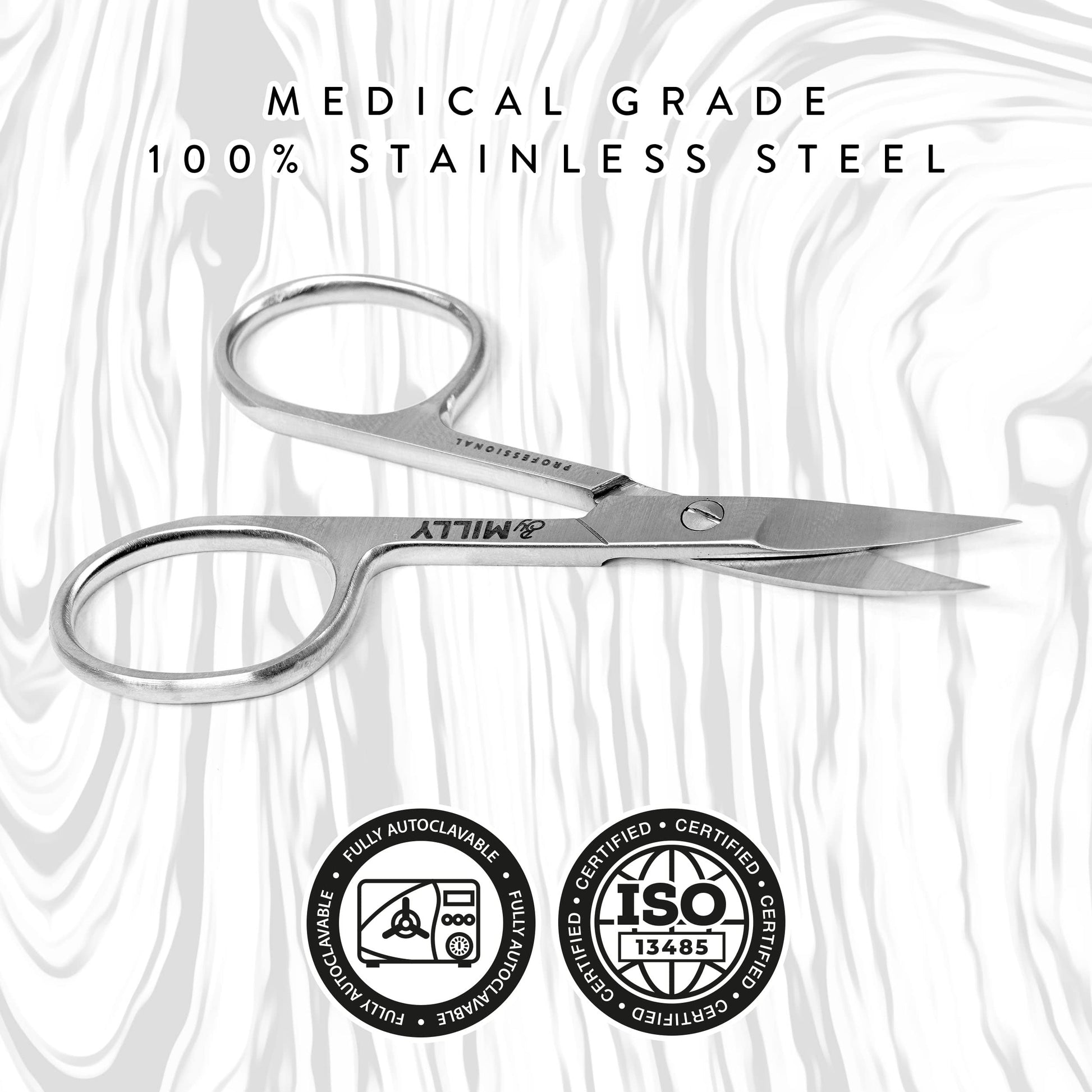 By MILLY professional three point five inch beauty scissors held to demonstrate ergonomic grip.