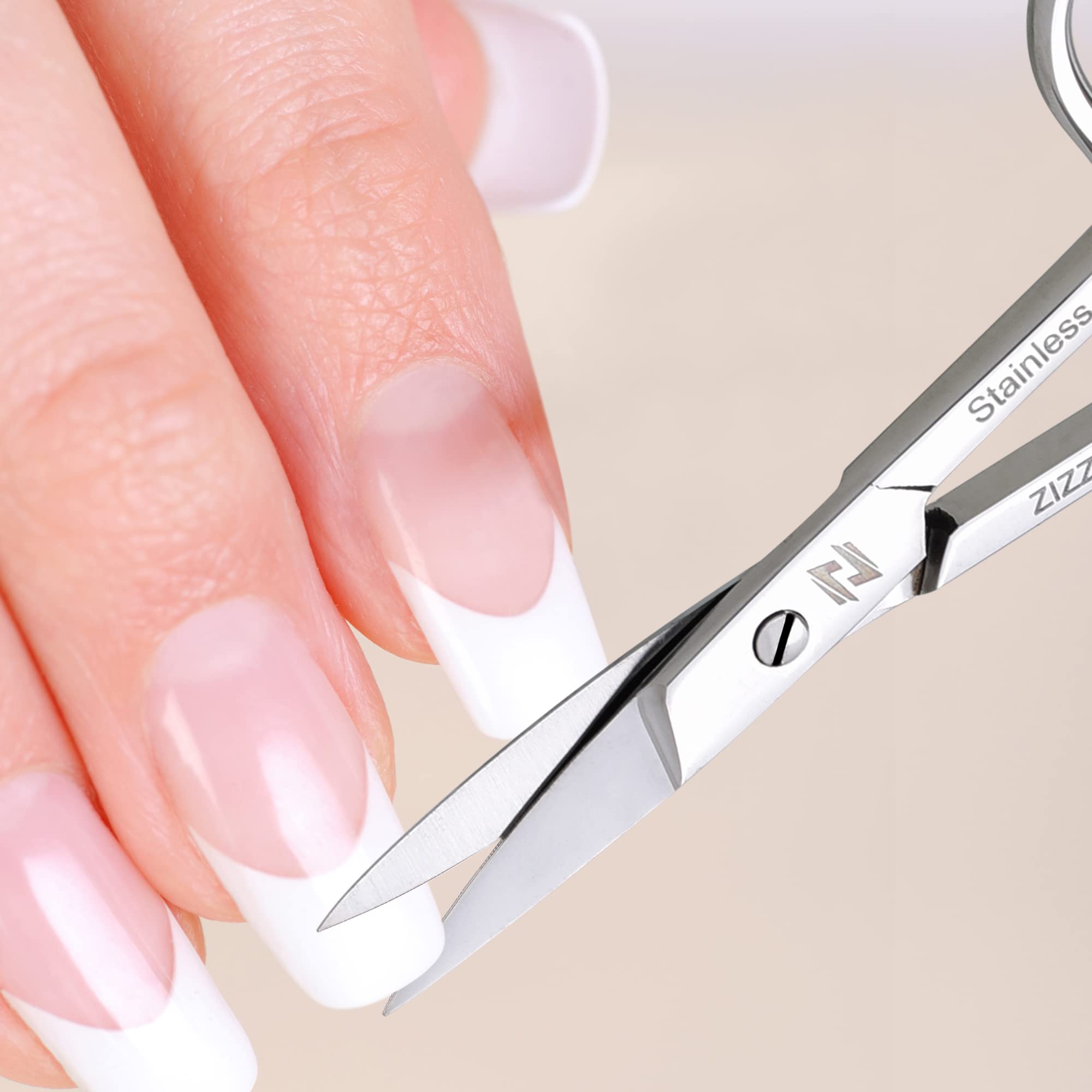 ZIZZLON professional manicure scissors showcasing the sharp curved micro serrated blades