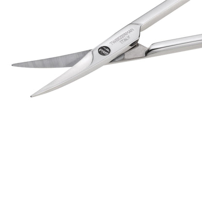 Close up angle of Tweezerman stainless steel cuticle nail scissors emphasizing the ultra fine sharp blades