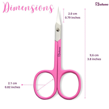Stelone stainless steel curved scissors placed flat next to a professional manicure kit