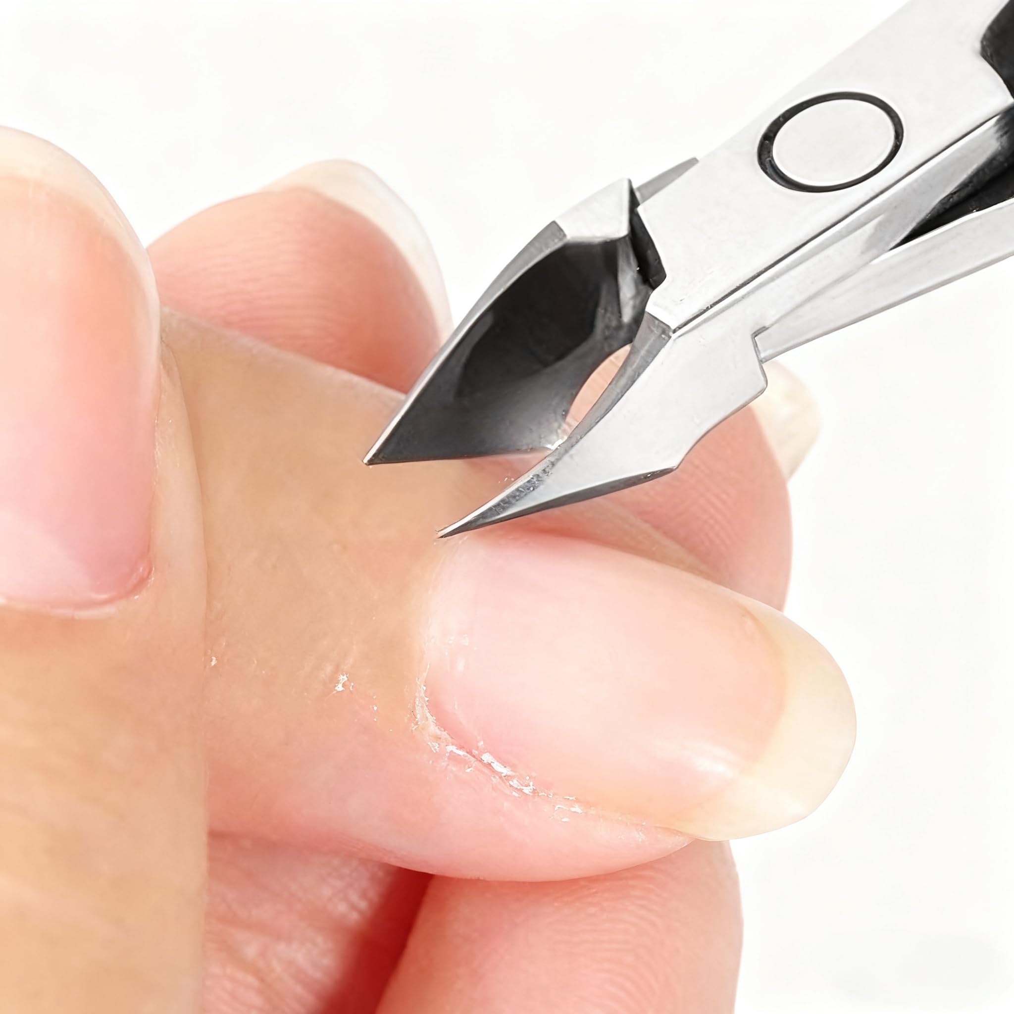 Professional stainless steel manicure tool shown alongside home pedicure essentials.