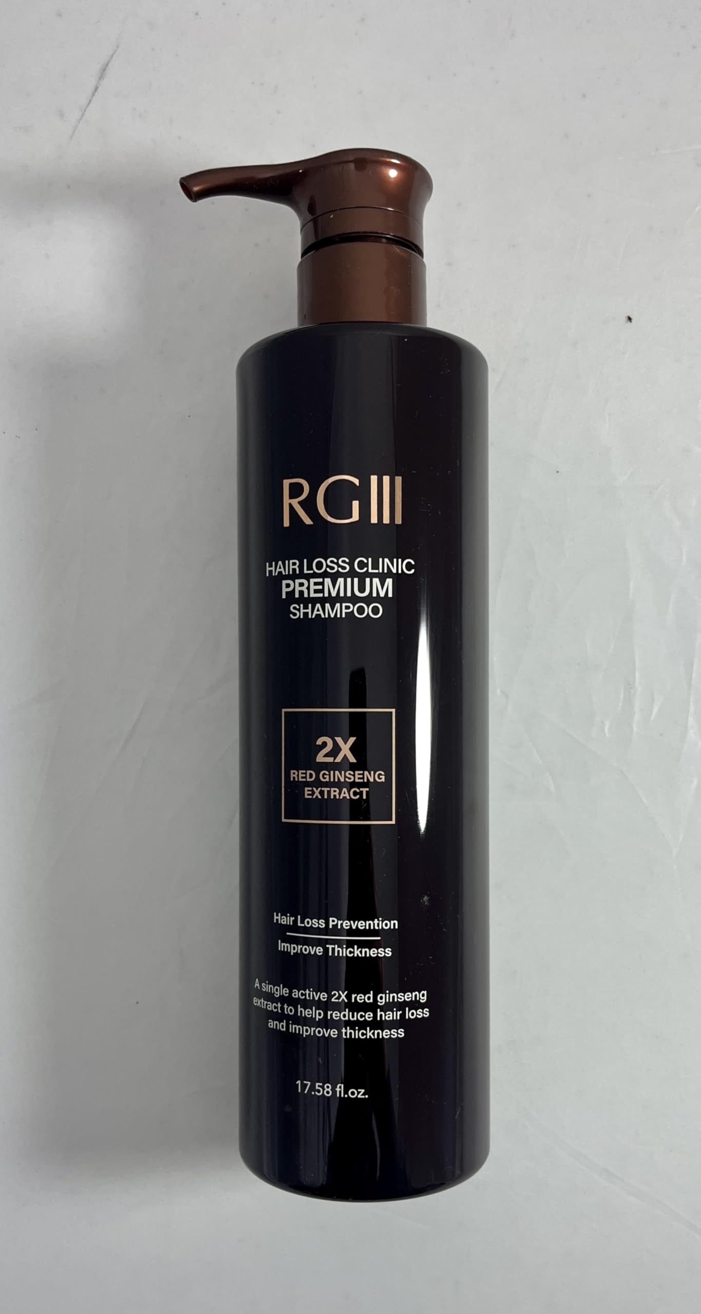 Close up view of the pump dispenser on the RG3 premium hair loss clinic shampoo.