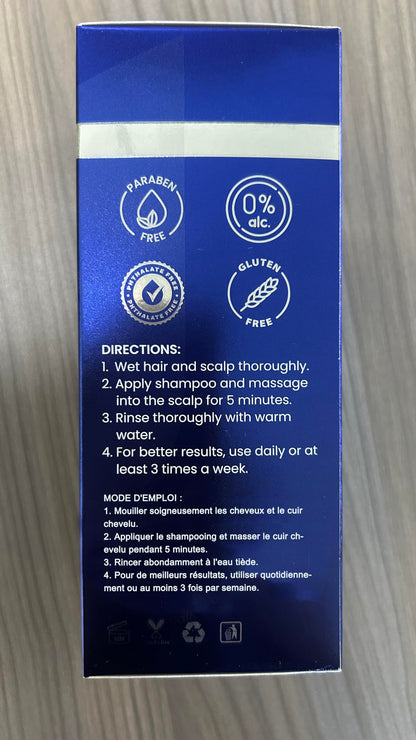 Side view of dark blue premium shampoo packaging showcasing professional strength follicle support