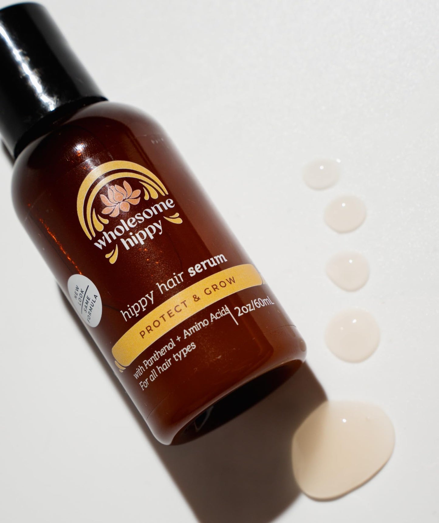 Wholesome Hippy amino acid and panthenol infused hair elixir packaging label details.