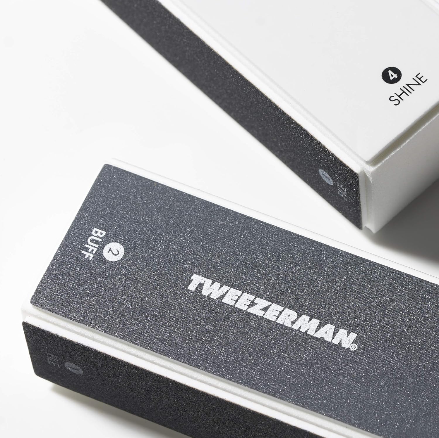 Tweezerman 4-sided nail buffer block showing color coded surfaces