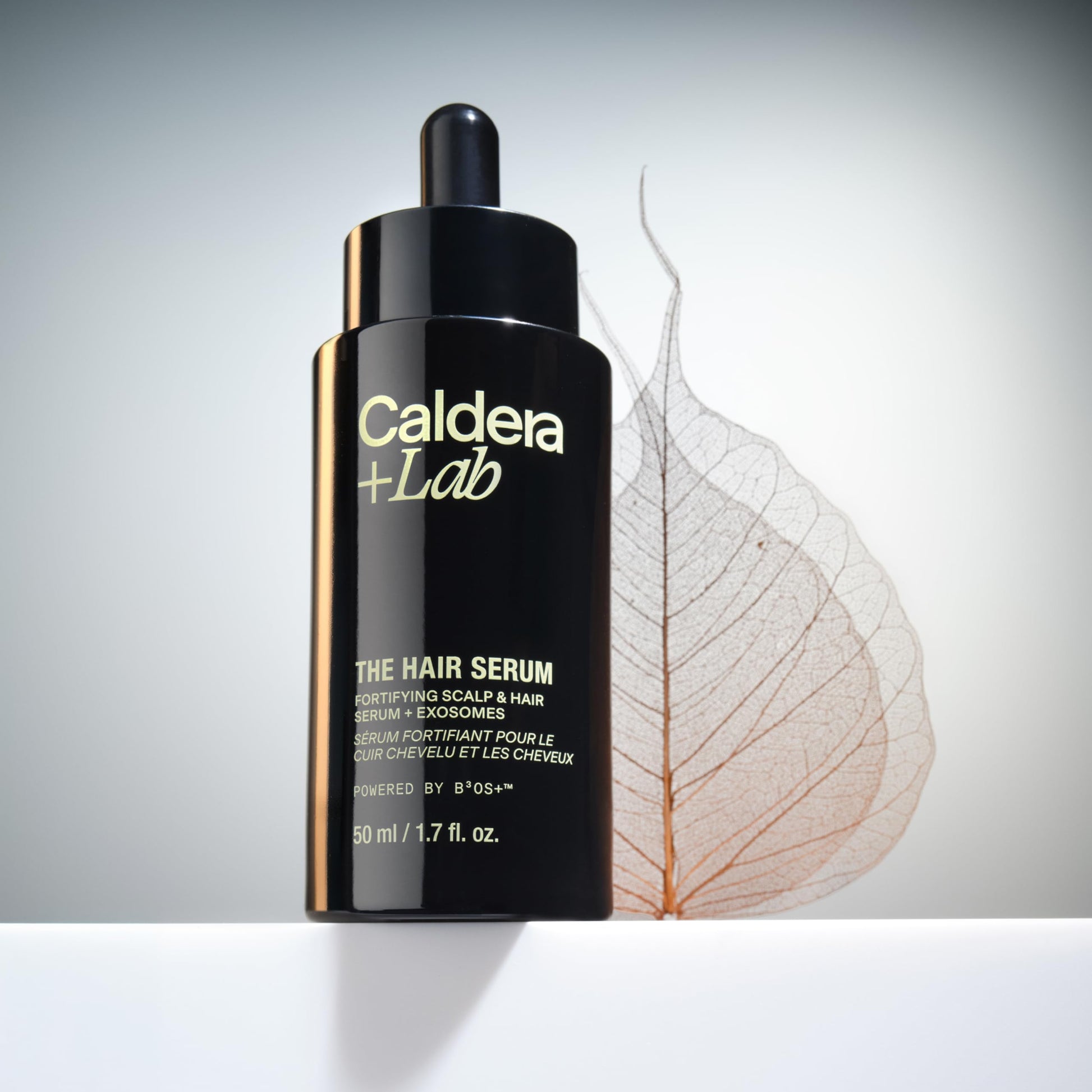 Side view of Caldera + Lab The Hair Serum highlighting plant exosome technology and ingredients.