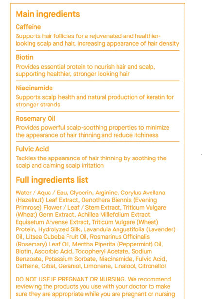 Close-up of the 50 ml SpoiledChild A22 hair growth serum capsule detailing the biotin and rosemary oil ingredients.