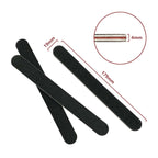Handheld manicure tools kit on white background
