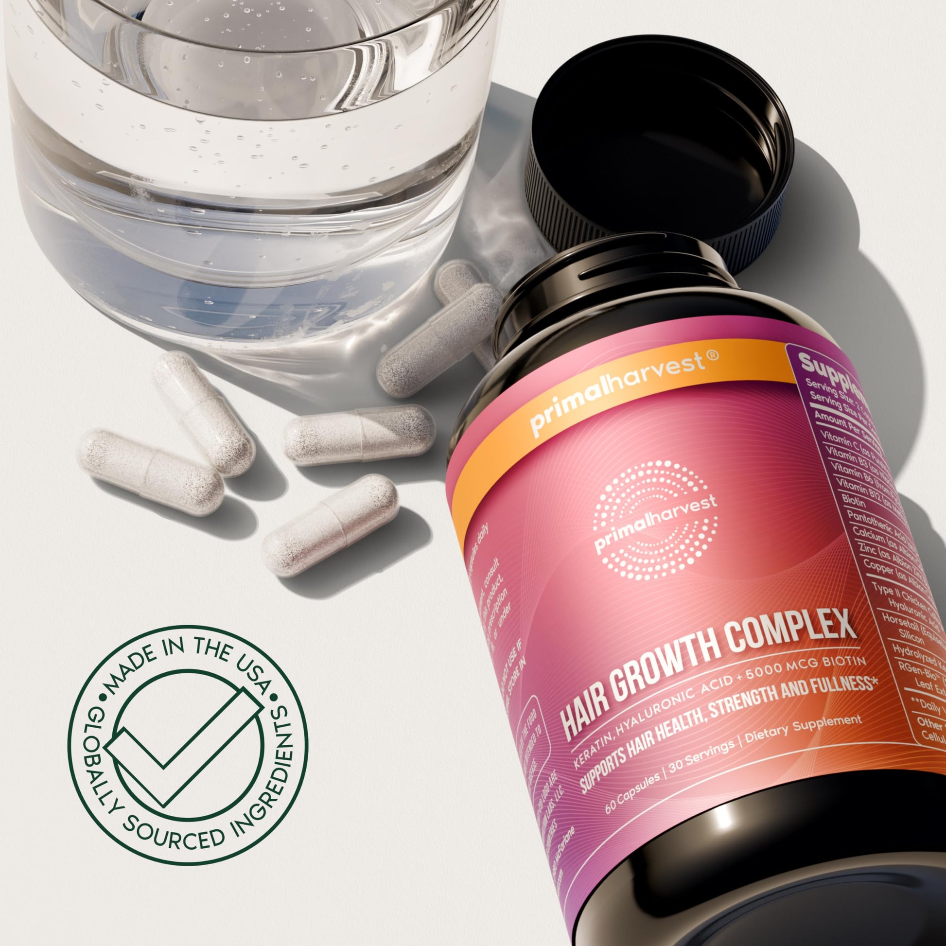 Primal Harvest hair regrowth supplement bottle for natural hair health and thickness.