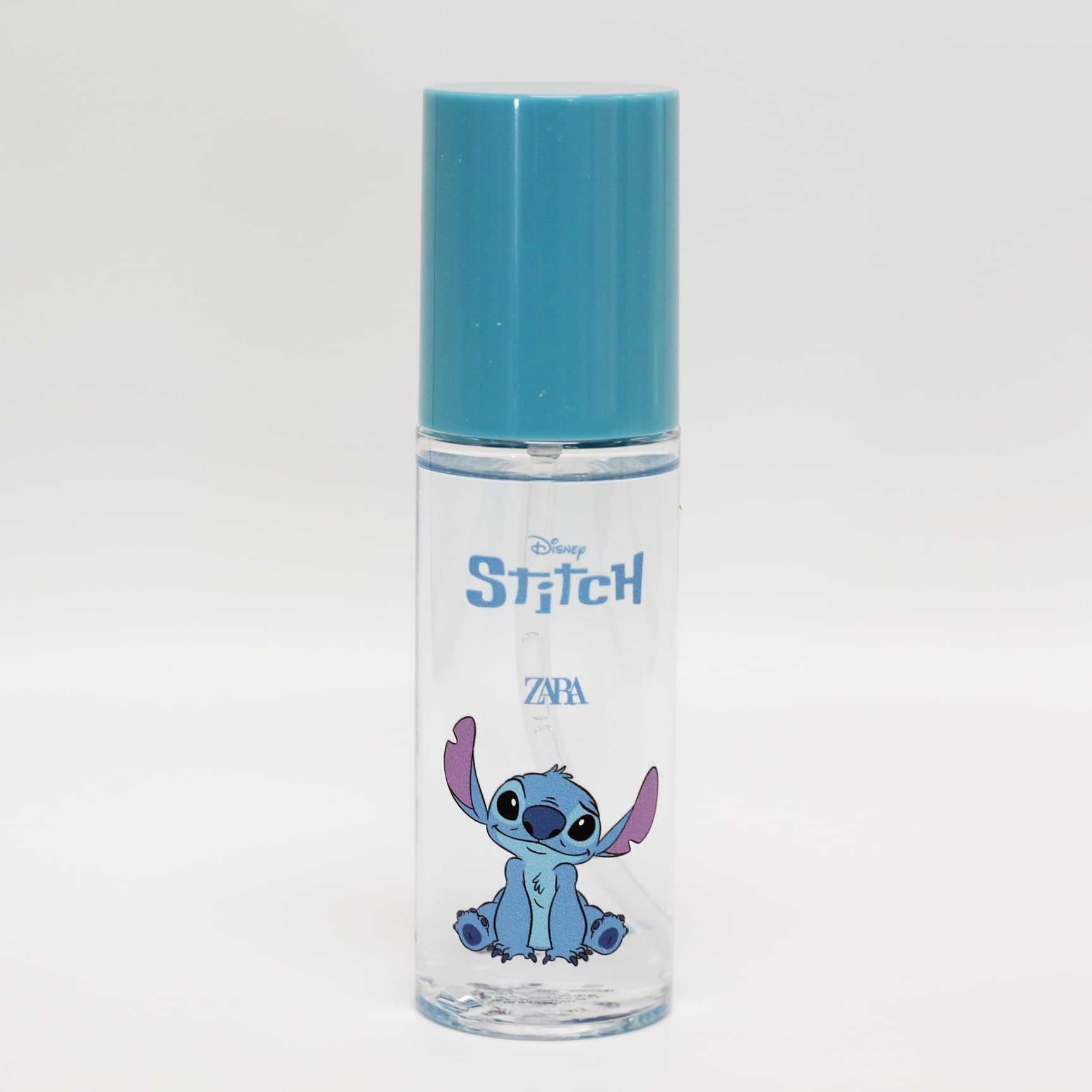 Authentic Zara Stitch children cologne spray bottle displaying product label and liquid contents clearly.