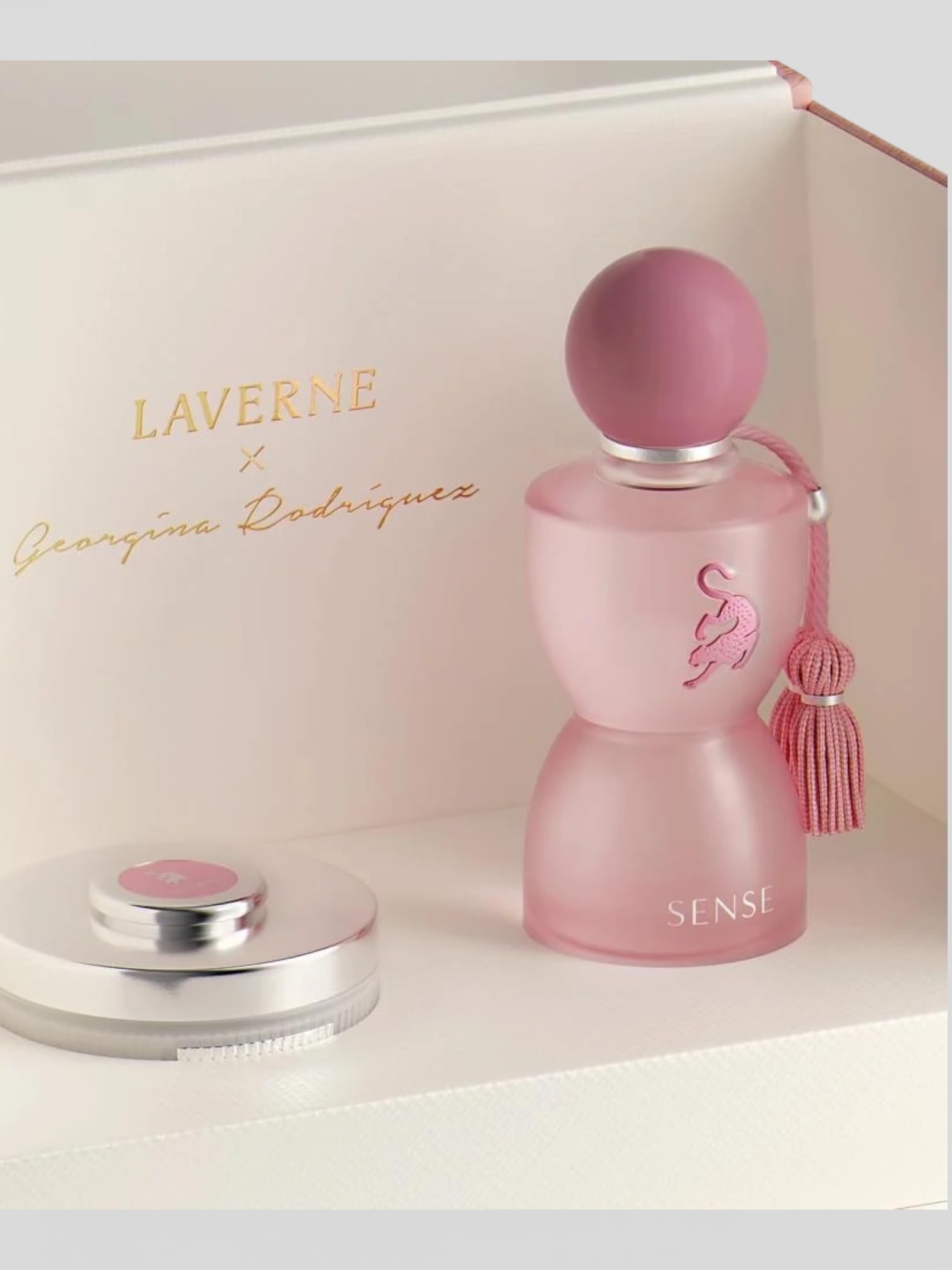 Close-up view of the luxury Saudi brand Laverne Sense perfume packaging with a designer scarf handle