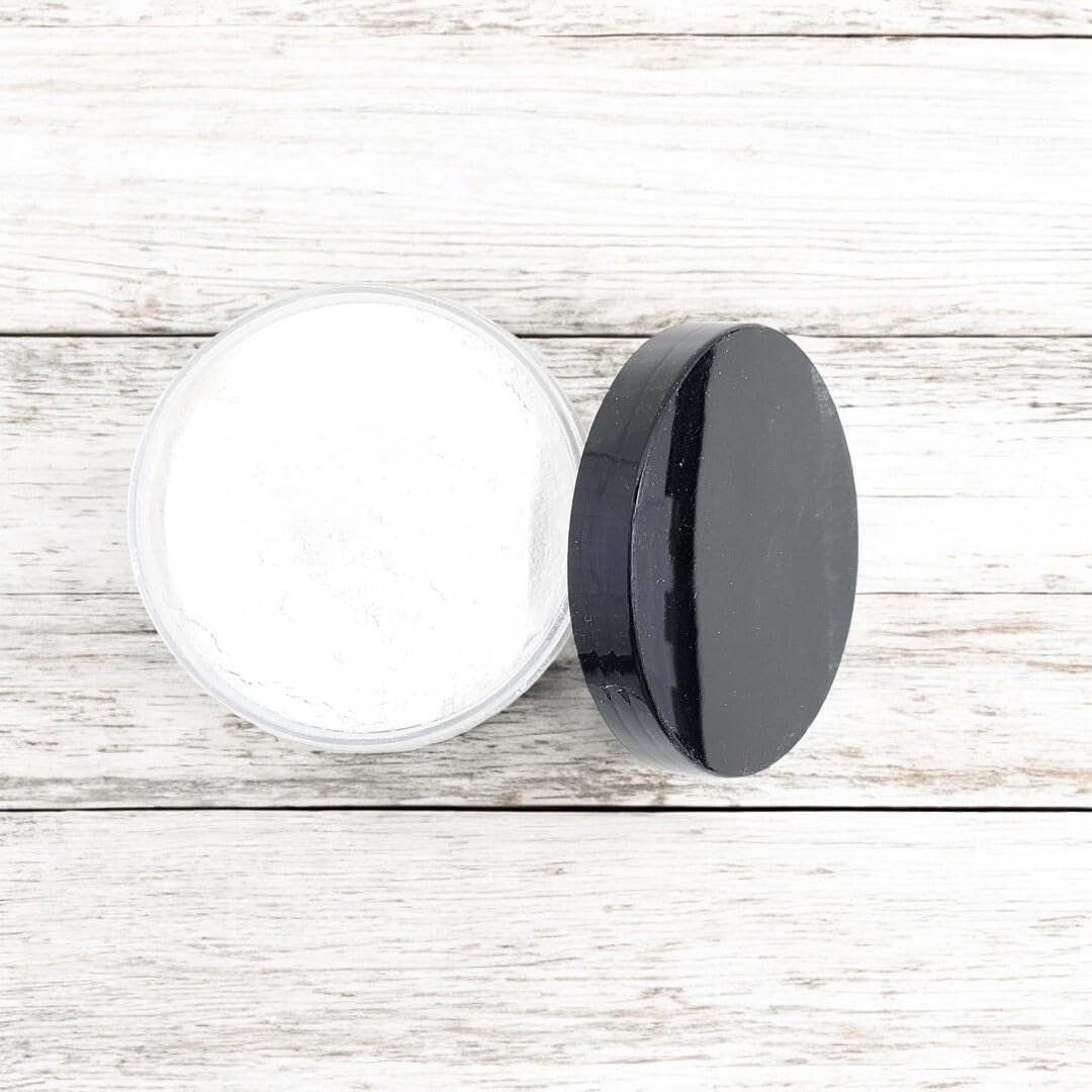 Belle and Kat luxury personal care dusting powder jar displaying ingredient information for sensitive skin protection.