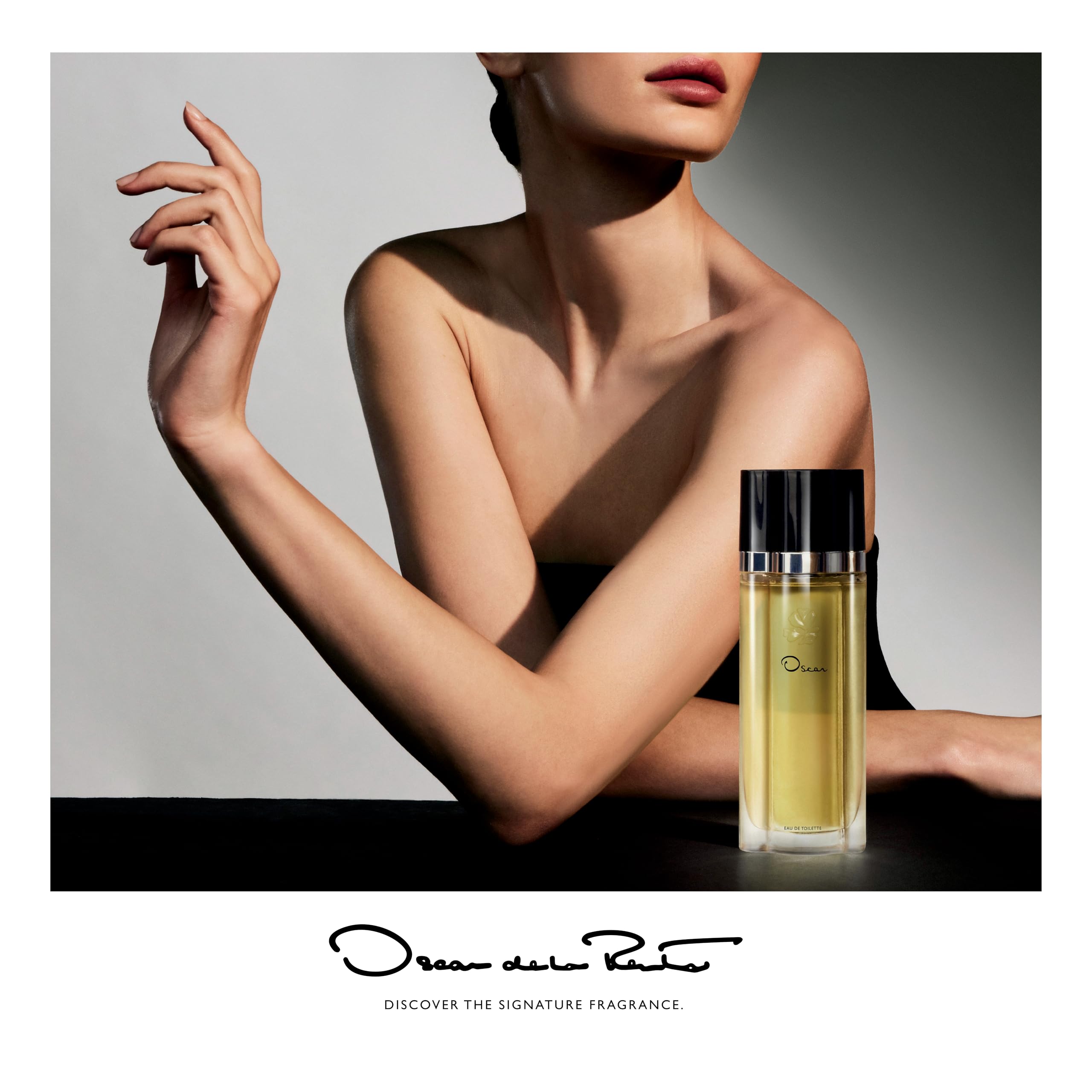 Oscar by Oscar de la Renta 5.2 Ounce dusting powder container with iconic branding