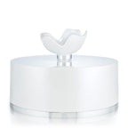 Luxury fine talc dusting powder container open to display the plush puff applicator inside