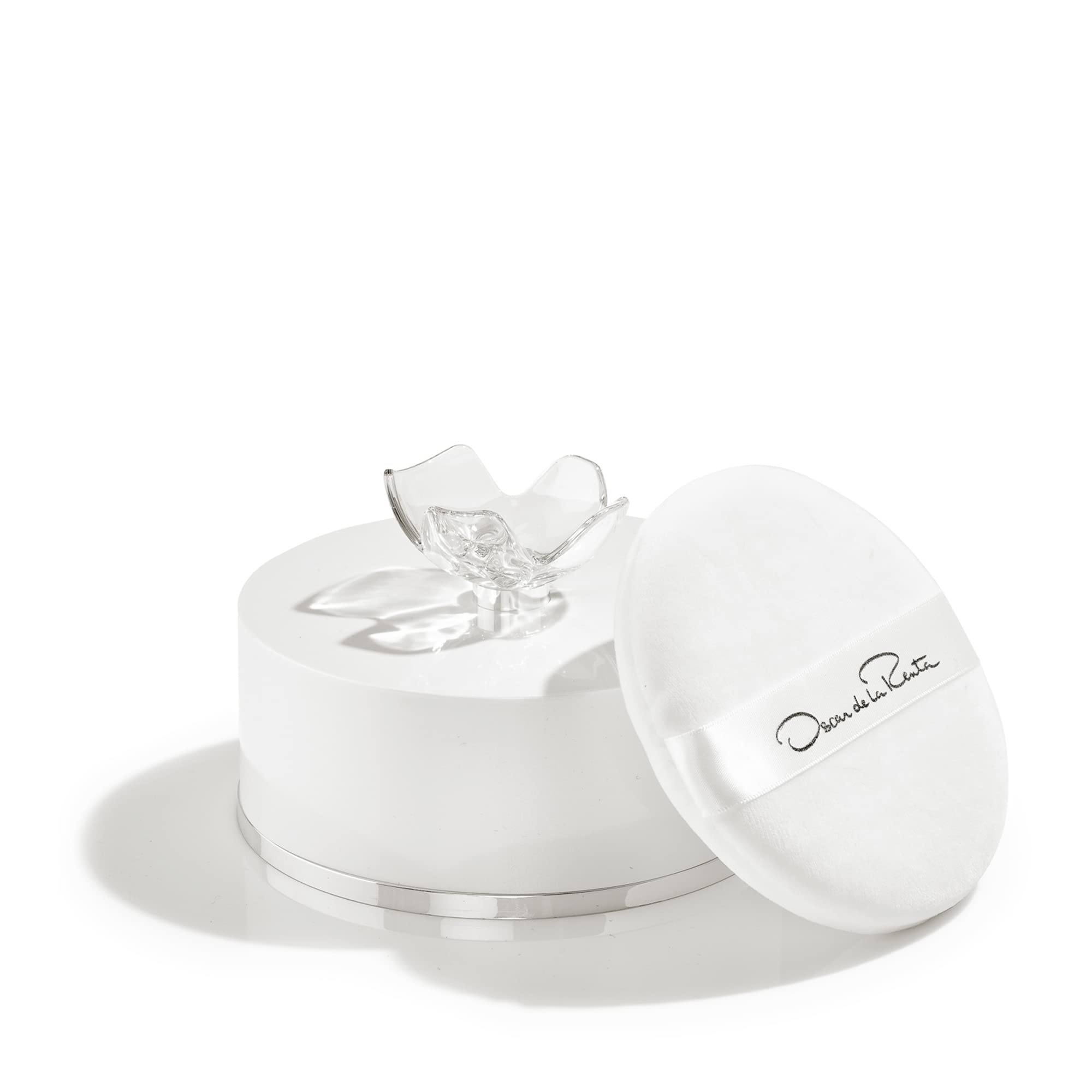 Oscar de la Renta signature scent luxury body powder for women displayed on vanity