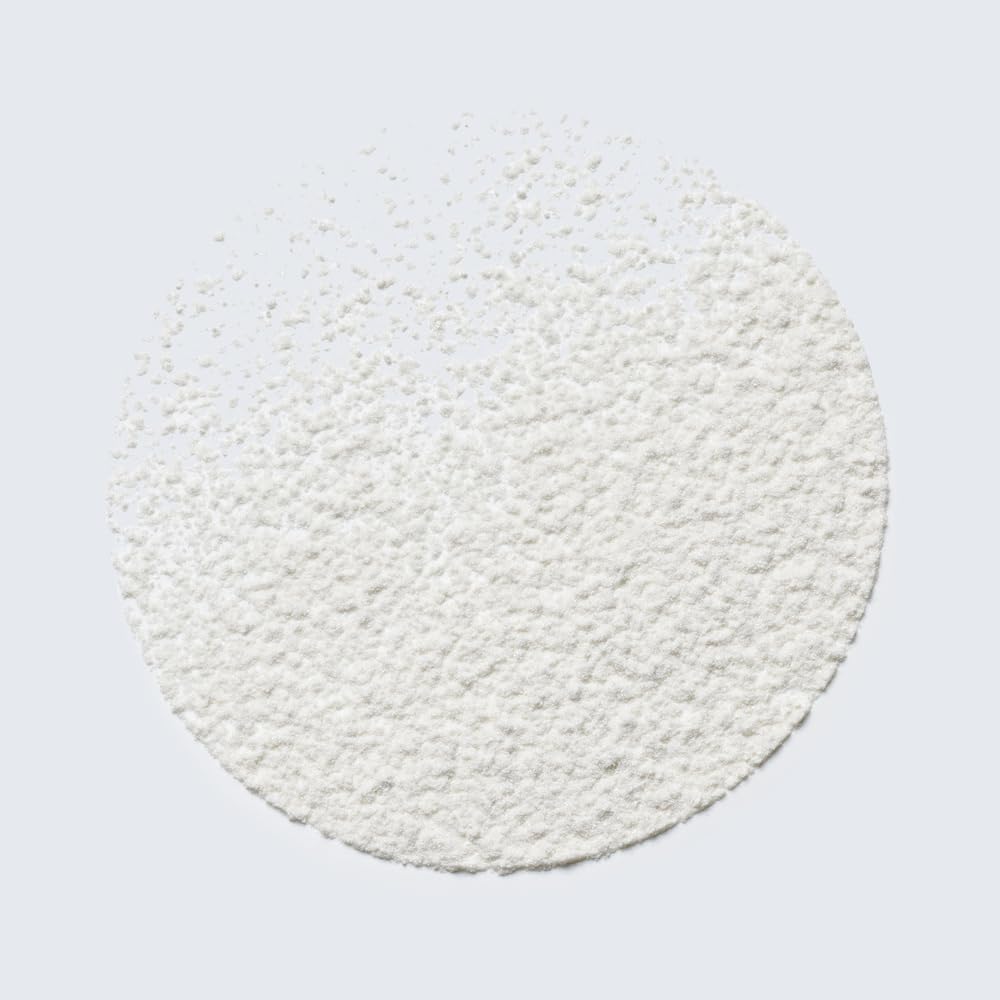 Close-up of the fine texture of Estée Lauder Youth-Dew perfumed powder with key fragrance note highlights.