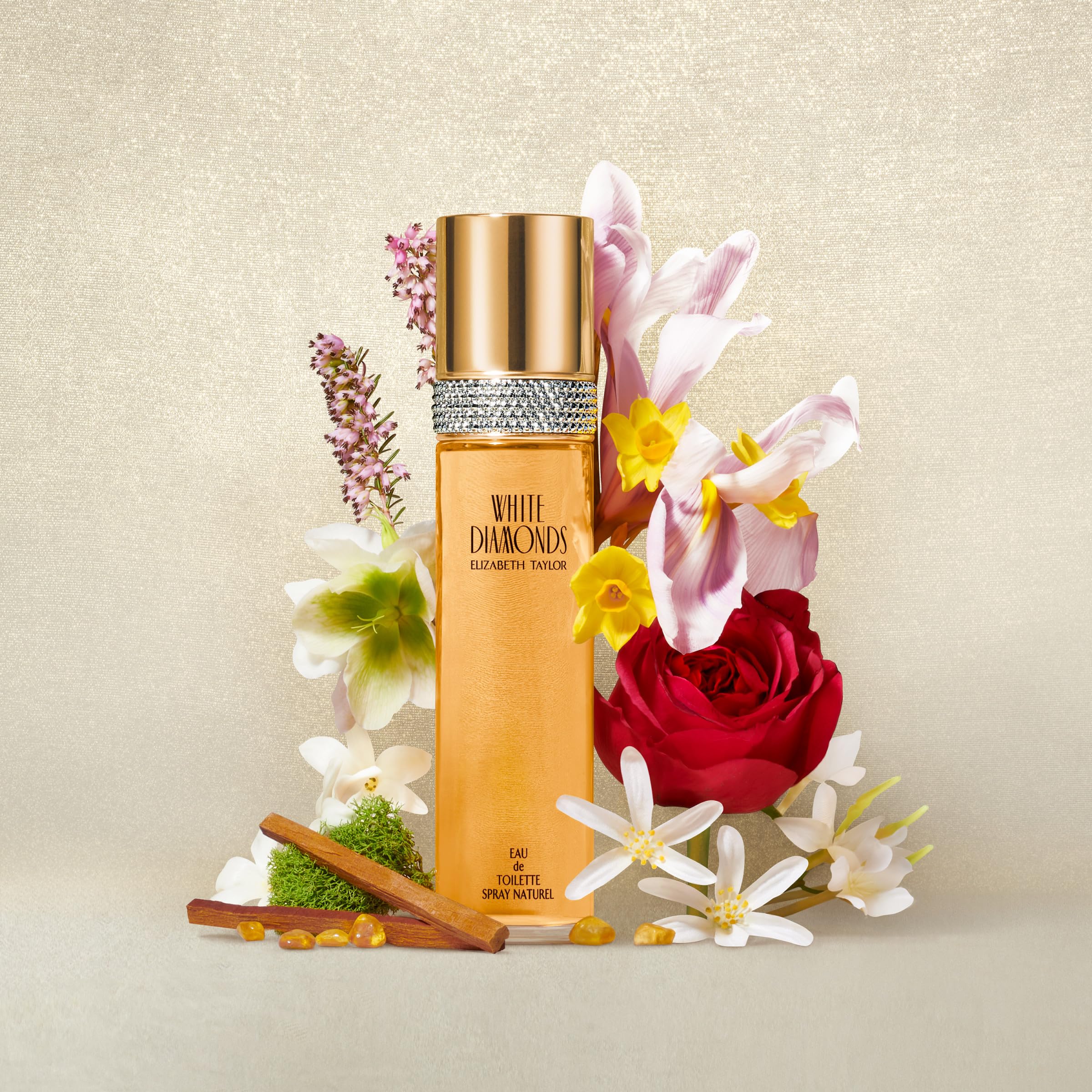 Elizabeth Taylor White Diamonds perfumed body lotion tube alongside the miniature parfum replica bottle